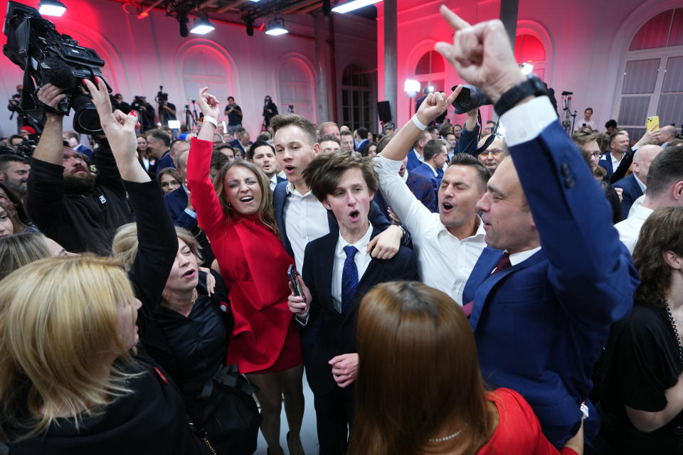 Supporters of Donald Tusk, a former Polish prime minister celebrate at his party headquarters in Warsaw, Poland, Sunday, Oct. 15, 2023. Poland's election result is on a knife edge as an exit poll says that the governing Law and Justice party won the most votes. (AP Photo/Petr David Josek)