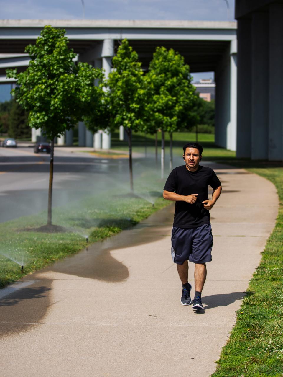 Abdullah Also runs for late morning exercise near Waterfront Park in downtown Louisville, Kentucky on June 14, 2022. 