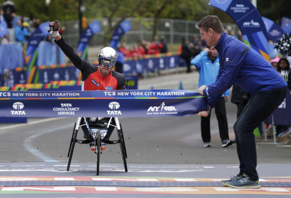 <p>Marcel Hug of Switzerland crosses the finish line first in the men’s wheelchair division of the New York City Marathon in New York, Sunday, Nov. 5, 2017. (Photo: Seth Wenig/AP) </p>