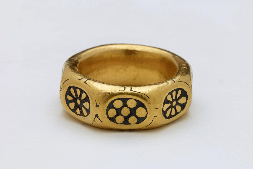 This undated handout photo provided by the British Museum shows a gold ring from the ninth century which was part of a £3 million Viking hoard, metal detectorists George Powell and Layton Davies have been convicted of stealing. Two amateur British treasure-hunters have on Friday, Nov. 22, 2019 been imprisoned for stealing a hoard of 1,100-year-old Anglo-Saxon coins and jewelry valued at millions of pounds. Experts say the hoard, much of which is still missing, could shed new light on a period when Saxons were battling Vikings for control of England. (British Museum via AP)