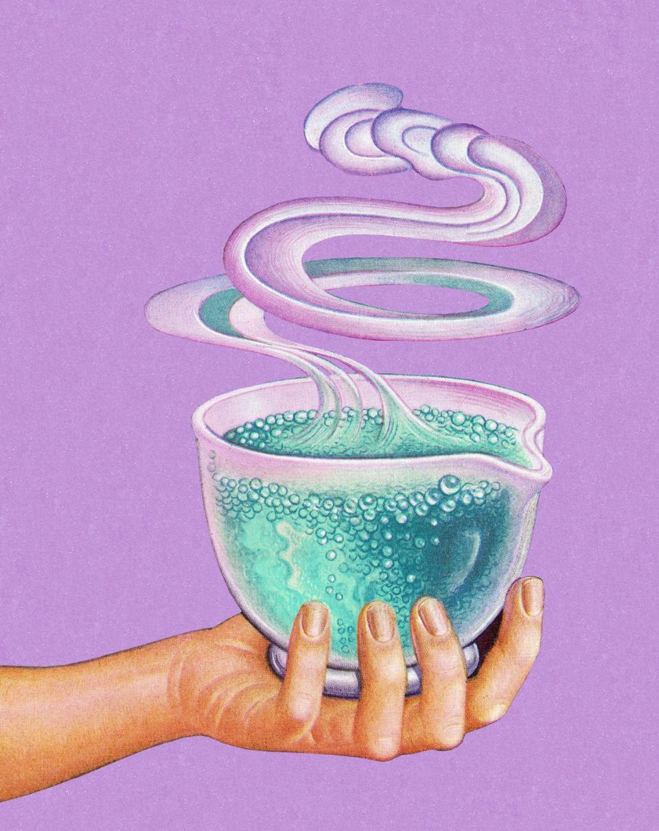 hand holding bubbling potion