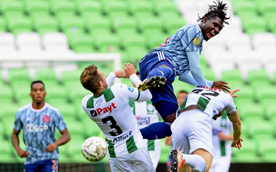 Bart van Hintum of Groningen (L), Lassina Traore (C) of Ajax, Gorkem Can (R) of Groningen in action during the Dutch Eredivisie soccer match between FC Groningen and Ajax  -  OLAF KRAAK/EPA-EFE/Shutterstock