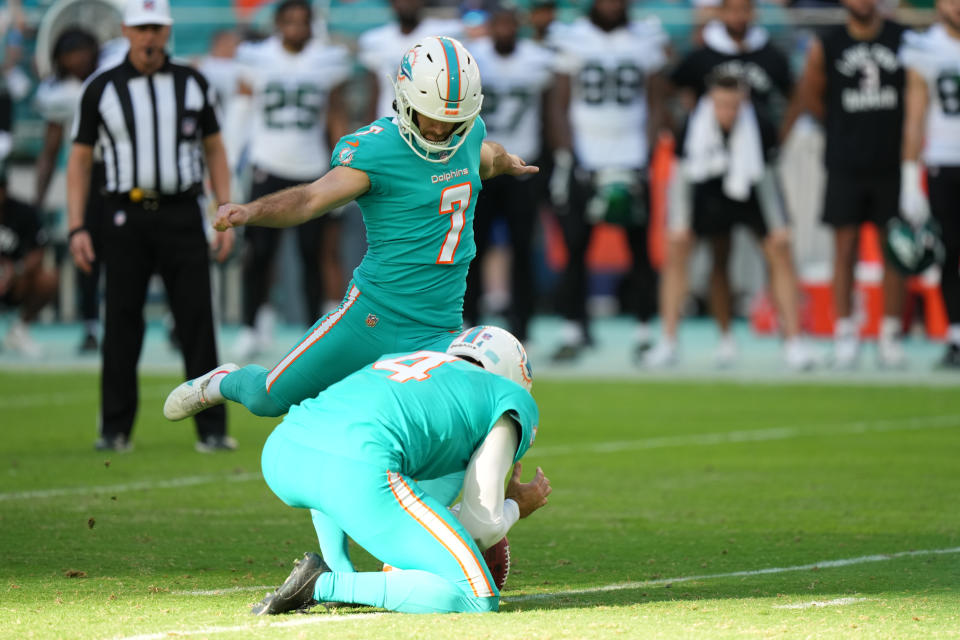 MIAMI GARDENS, FL - JANUARY 08: Miami Dolphins place kicker Jason Sanders (7) kicks the game winning field goal as Miami Dolphins punter Thomas Morstead (4) holds during the game between the New York Jets and the Miami Dolphins on Sunday, January 8, 2023 at Hard Rock Stadium, Miami Gardens, Fla. (Photo by Peter Joneleit/Icon Sportswire via Getty Images)