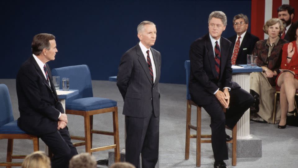 Presidential candidates Bill Clinton, right, Ross Perot, center, and President George Bush, left, participate in a debate in 1992. - Wally McNamee/Corbis/Getty Images