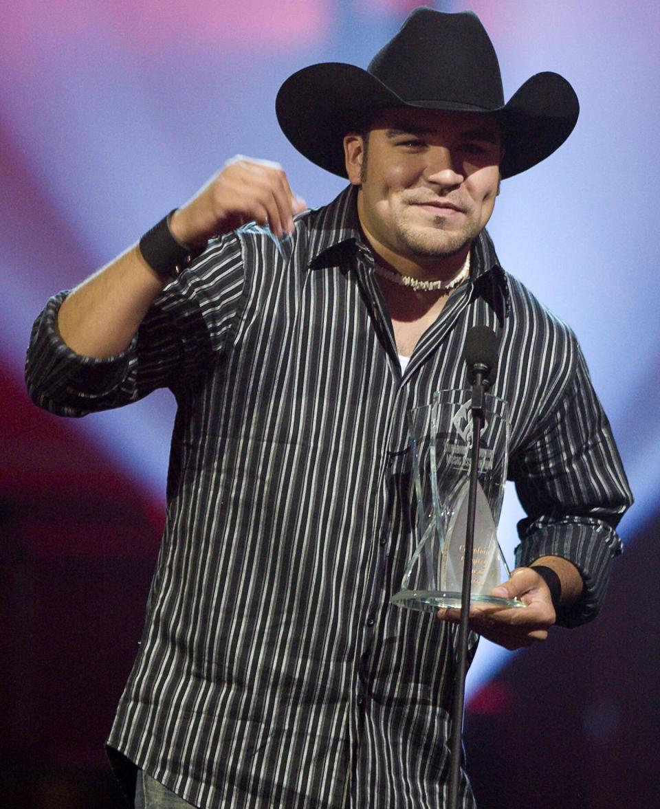 Shane Yellowbird accepts the Chevy Rising Star award during the Canadian Country Music Awards