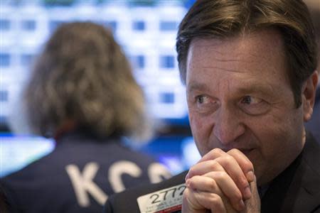 Specialists Thomas Facchine waits for a stock to open on the floor of the New York Stock Exchange March 6, 2014. REUTERS/Brendan McDermid