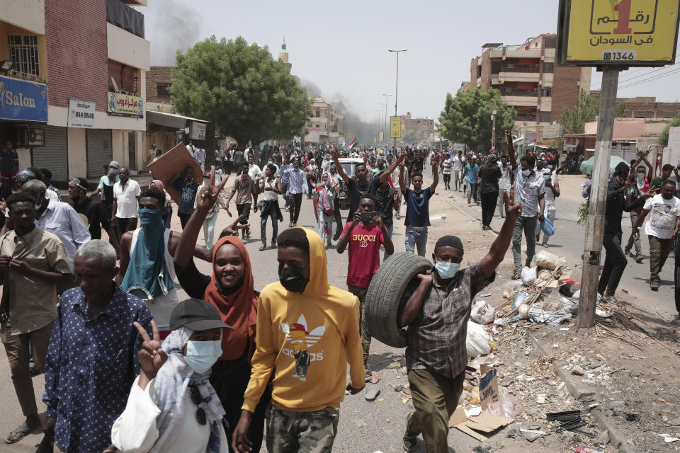 Sudanese anti-military protesters march in demonstrations in the capital of Sudan, Khartoum, on Thursday, June 30, 2022. A Sudanese medical group says multiple people were killed on Thursday in the anti-coup rallies during which security forces fired on protesters denouncing the country’s military rulers and demanding an immediate transfer of power to civilians. (AP Photo/Marwan Ali)