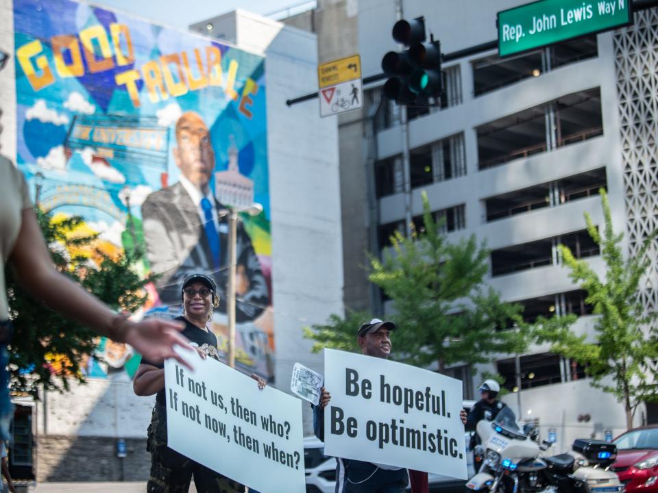 The East Nashville Magnet Band & Cheerleaders march through the Rep. John Lewis Way in Nashville, to the Ryman Auditorium, Saturday, July 23, 2022. 
