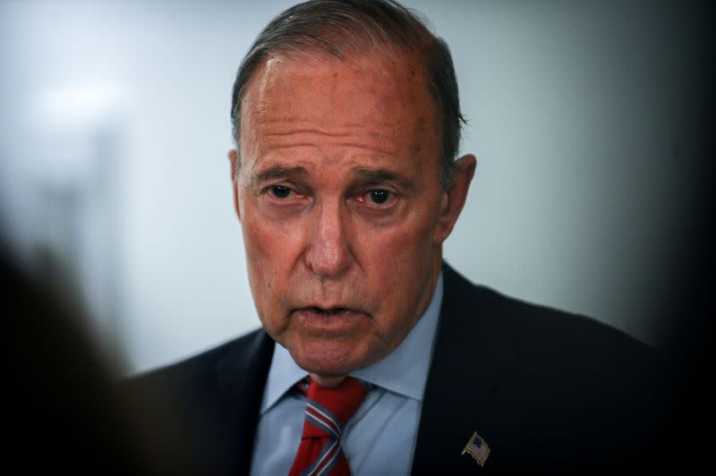 White House National Economic Council Director Larry Kudlow talks with media during a break in a meeting to wrap up work on coronavirus economic aid legislation