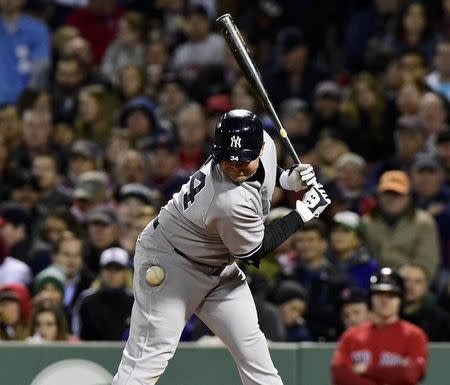 May 1, 2015; Boston, MA, USA; New York Yankees catcher Brian McCann (34) is hit by a pitch during the fifth inning against the Boston Red Sox at Fenway Park. Mandatory Credit: Bob DeChiara-USA TODAY Sports
