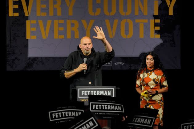 Fetterman speaks at his first post-stroke rally in Erie, Pennsylvania, on Aug. 12. His wife, Gisele Barreto Fetterman, looks on. His investment in Erie reflected his 