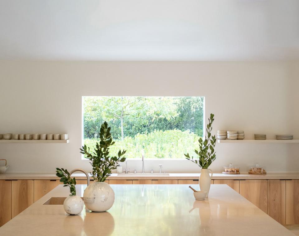 Shiro Tsujimura ceramic vases top the kitchen island.