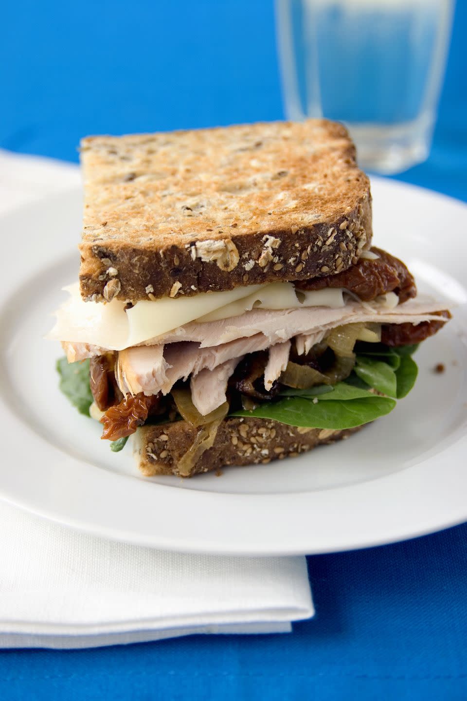 mediterranean diet lunch sandwich on whole grain bread with turkey tomato and lettuce
