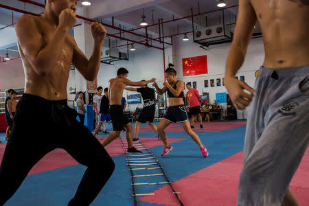 Huang Wensi in action during her final training session in Ningbo, Zhejiang province, China, before she heads to Taiwan for her Asia Female Continental Super Flyweight Championship match, September 23, 2018. REUTERS/Yue Wu