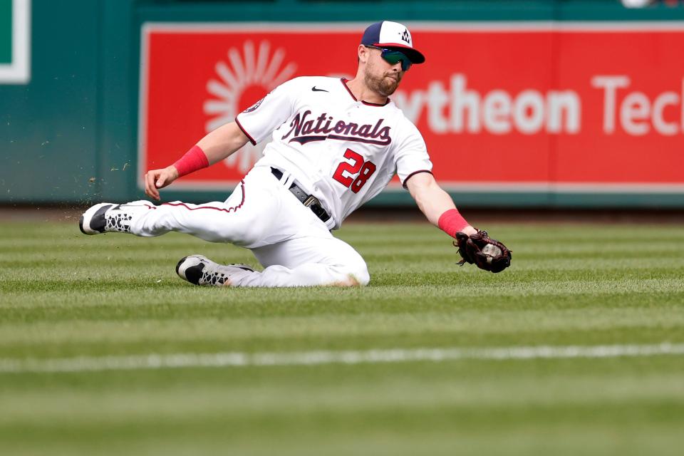 April 16: Washington Nationals right fielder Lane Thomas slides to make a catch on a fly ball hit by Cleveland Guardians catcher Mike Zunino (not pictured) during the ninth inning. The National held on for a 7-6 win.