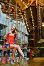 Ekaterina enjoys a ride on the Golden Mirror Carousel at the National Gallery of Victoria.