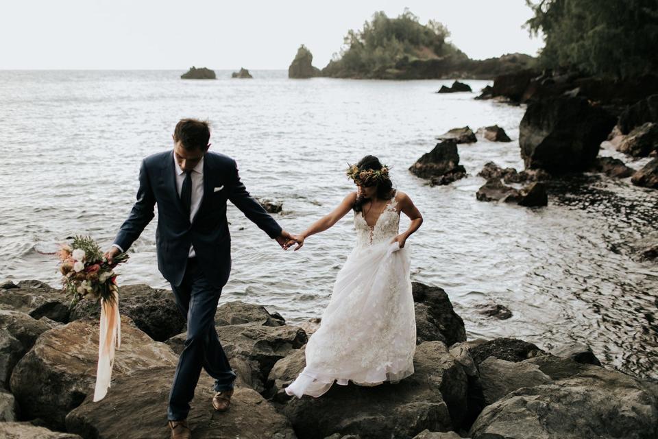 A couple celebrates their wedding at Hāna-Maui Resort on the island of Maui in Hawaii.