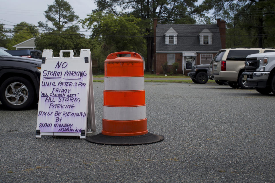 Trinity United Methodist Church in Poquoson, Va., opened their parking lot to local residents to park their vehicles in response to Tropical Storm Ophelia on Saturday, Sept. 23, 2023. The City of Poquoson, a local fishing community near NASA Langley Research Center, has low level areas that are prone to flooding. (AP Photo/John C. Clark)