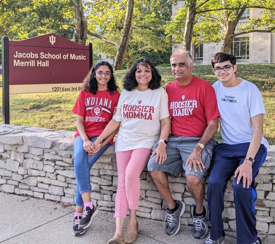 Tiara Abraham poses outside the Indiana University Jacobs School of Music with her family, mother Tajij Abraham, father Bijou Abraham and brother Tanishq Abraham.