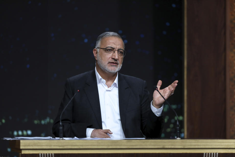 In this picture made available by Iranian state-run TV, IRIB, presidential candidate for June 28 election Alireza Zakani, who is Tehran Mayor, speaks in a debate of the candidates at the TV studio in Tehran, Iran, Thursday, June 20, 2024. (Morteza Fakhri Nezhad/IRIB via AP)