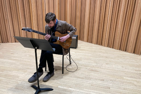 Composer James Romig wrote the piece for guitarist Matt Sargent, who will perform it at the Figge lobby Sunday, March 3 at 1 p.m.