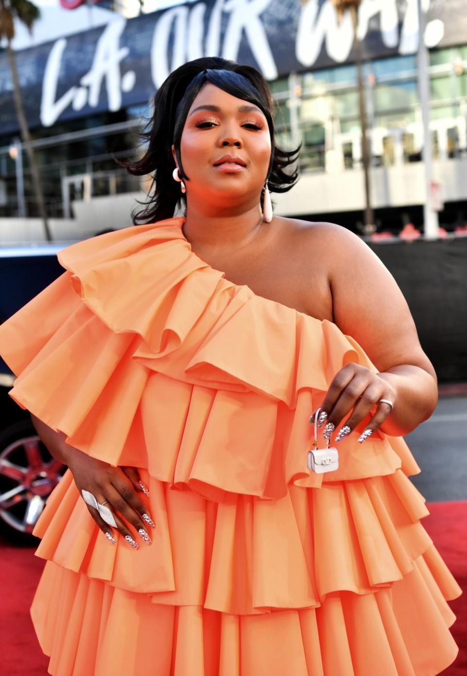 <p>In 2019, Lizzo reached mainstream success with the release of her third studio album, <em>Cuz I Love You.</em> The popularity of her performance during the 2019 MTV Video Music Awards launched Lizzo into the public eye, and her older music, including the 2016 single "Good as Hell," began to <a href="https://slate.com/culture/2019/09/lizzo-truth-hurts-number-1-billboard-hot-100.html" rel="nofollow noopener" target="_blank" data-ylk="slk:resurface at the top of the charts;elm:context_link;itc:0;sec:content-canvas" class="link ">resurface at the top of the charts</a>. In December, she performed on <em>Saturday Night Live</em> with Eddie Murphy serving as host. Her eight Grammy nominations include Best New Artist and Album of the Year. </p>