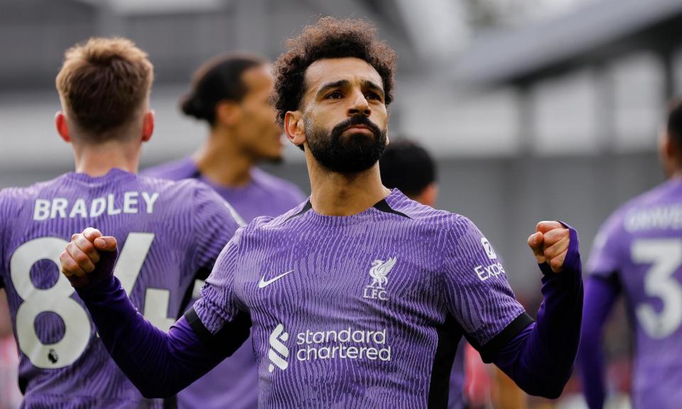 <span>Mohamed Salah celebrates after scoring Liverpool’s third goal in the 4-1 victory at Brentford.</span><span>Photograph: Tom Jenkins/The Guardian</span>