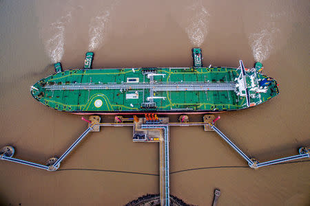 FILE PHOTO - An oil tanker unloads crude oil at a crude oil terminal in Zhoushan, Zhejiang province, China July 4, 2018. REUTERS/Stringer/File Photo