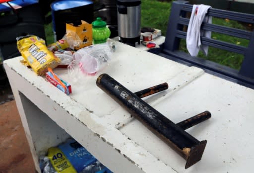 A homemade mortar lies on a table next to students' provisions