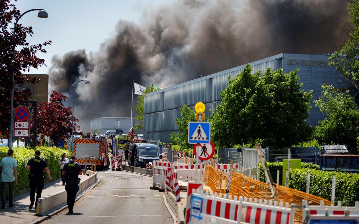 Smoke rises from a fire at Novo Nordisk in Bagsvaerd on May 22