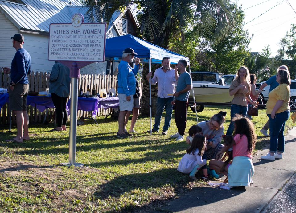 East Hill residents gather to celebrate the dedication of a new memorial commemorating the National Votes for Women Trail in the Pensacola neighborhood on Monday, April 17, 2023. The landmark designation is the former East Hill homeowner and suffragist Celia Myrover Robinson.