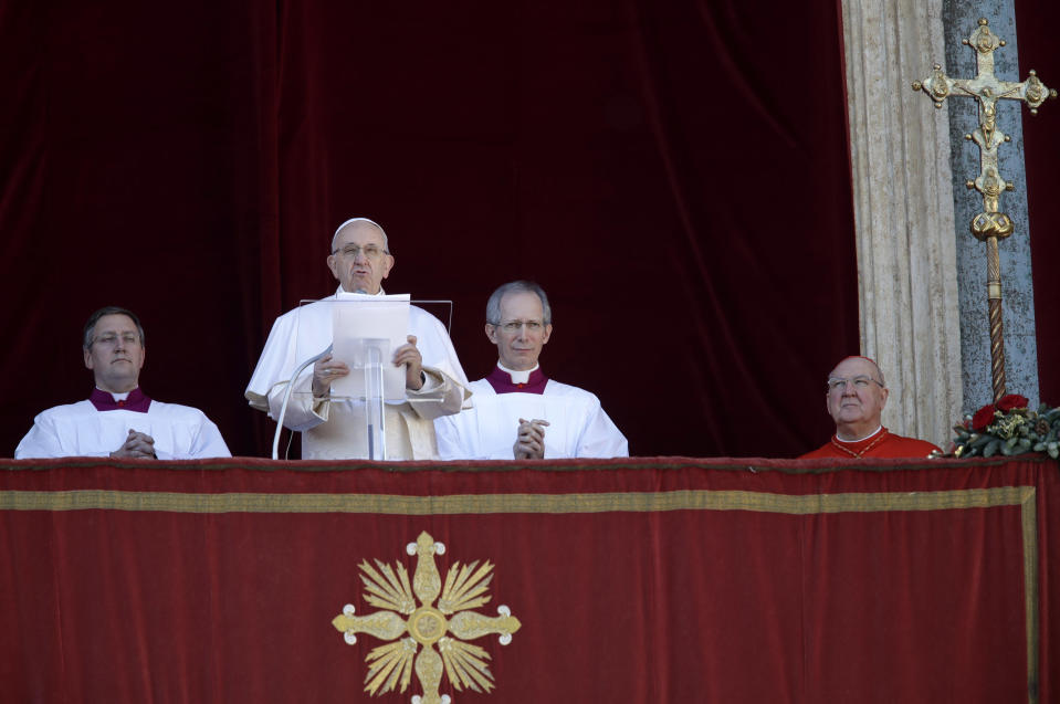 Pope Francis delivers his message during the Urbi et Orbi (Latin for 'to the city and to the world' ) Christmas' day blessing from the main balcony of St. Peter's Basilica at the Vatican, Tuesday, Dec. 25, 2018. (AP Photo/Alessandra Tarantino)