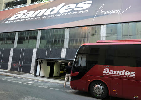 A man stands outside the Bandes bank headquarters in Caracas, Venezuela March 22, 2019. REUTERS/Carlos Garcia Rawlins