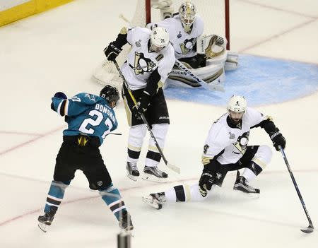 San Jose Sharks right wing Joonas Donskoi (27) takes the game-winning shot past Pittsburgh Penguins center Evgeni Malkin (71), Penguins defenseman Justin Schultz (4) and Penguins goalie Matt Murray (30) in the overtime period of game three of the 2016 Stanley Cup Final at SAP Center at San Jose. Mandatory Credit: John Hefti-USA TODAY Sports