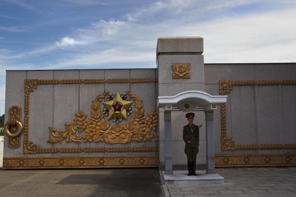 FILE - A North Korean soldier stands guard at his post at the entry gate to the Kumsusan Palace of the Sun, the mausoleum where the bodies of the late leaders Kim Il Sung and Kim Jong Il lie embalmed, in Pyongyang on July 25, 2013. North Korea’s Kim Jong Un's train journey to Russia has a storified history. The tradition of train travel extends across the generations. That’s in evidence at the massive Kumsusan Palace of the Sun, where reconstructions of Kim Jong Un’s father’s and grandfather’s train cars, and the leaders’ preserved and displayed remains, are enshrined. (AP Photo/David Guttenfelder, File)