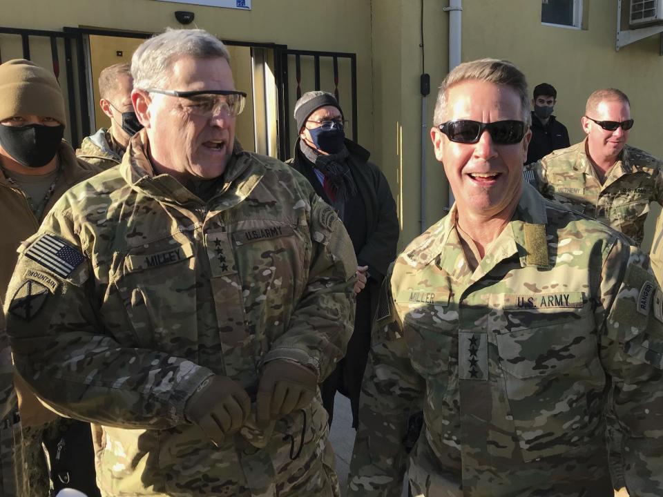 Chairman of the U.S. Joint Chiefs of Staff Gen. Mark Milley, left, talks with Gen. Scott Miller, the commander of U.S. and coalition forces in Afghanistan, Wednesday, Dec. 16, 2020 at Miller’s military headquarters in Kabul, Afghanistan. The top U.S. military officer has held an unannounced meeting with Taliban peace negotiators to push for a reduction in violence in Afghanistan. (AP Photo/Robert Burns)