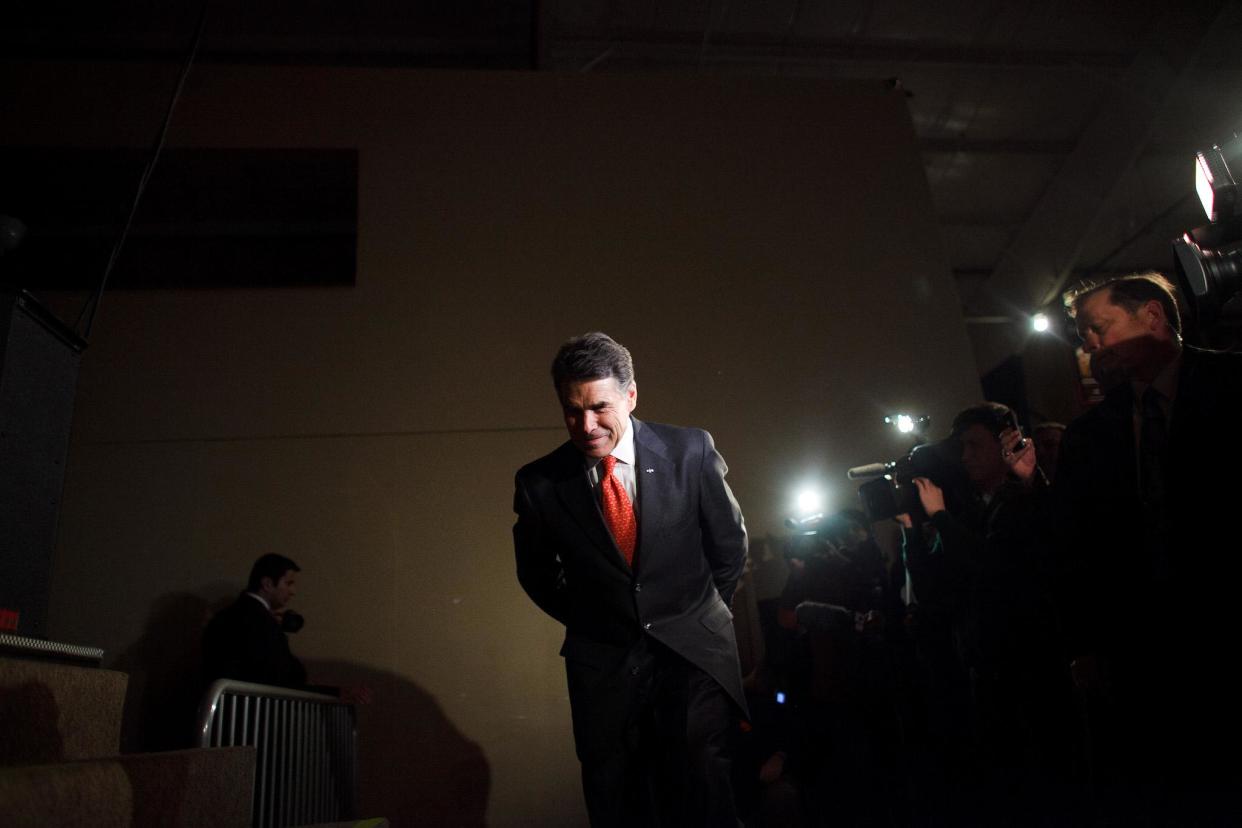 Republican presidential candidate, Texas Gov. Rick Perry prepares to speak with voters attending the West Des Moines Precinct 1 and 2 GOP Caucus held at the Seven Flags Event Center January 3, 2012 in West Des Moines, Iowa: Jonathan Gibby/Getty Images