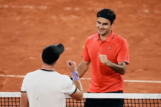 Roger Federer, right, got the better of Dominik Koepfer in a late-night battle