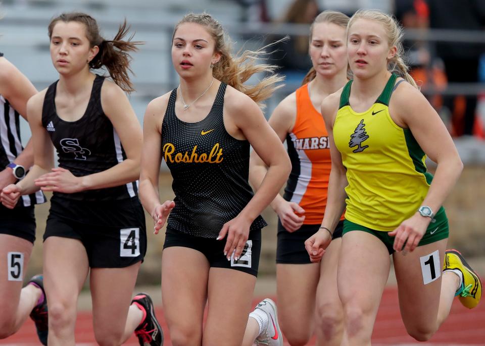 Rosholt's Sophia Bablitch and D.C. Everest's Sara Mlodik compete in the 3,200-meter run during a track and field invitational April 29 at Goerke Field in Stevens Point.