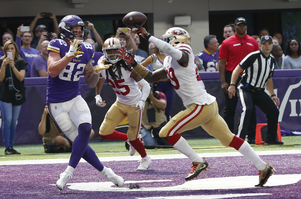 <p>Minnesota Vikings tight end Kyle Rudolph (82) catches an 11-yard touchdown pass in front of San Francisco 49ers safety Jaquiski Tartt, right, during the second half of an NFL football game, Sunday, Sept. 9, 2018, in Minneapolis. (AP Photo/Jim Mone) </p>