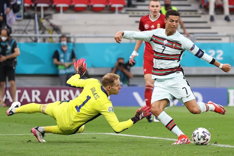 Portugal's forward Cristiano Ronaldo scores his team's third goal during the UEFA EURO 2020 Group F football match between Hungary and Portugal at the Puskas Arena in Budapest on June 15, 2021 (POOL/AFP via Getty Images)