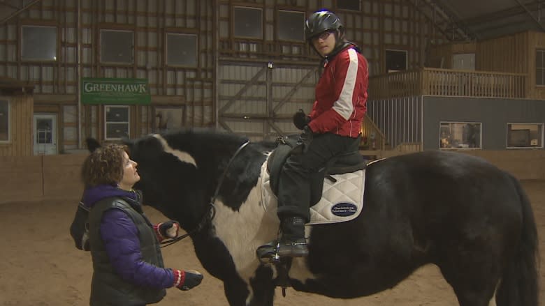 Para-equestrian's delicate dance makes teen's disability 'disappear'