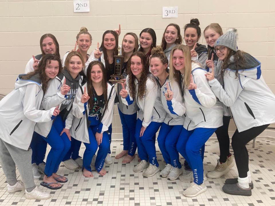 The Villa Maria Victors pose with the championship trophy after they won the North East Girls Swimming and Diving Invitational on January 15, 2022.