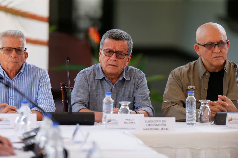 FILE PHOTO: Members of Colombia's government and Colombia's National Liberation Army (ELN) delegation address the media, in Caracas