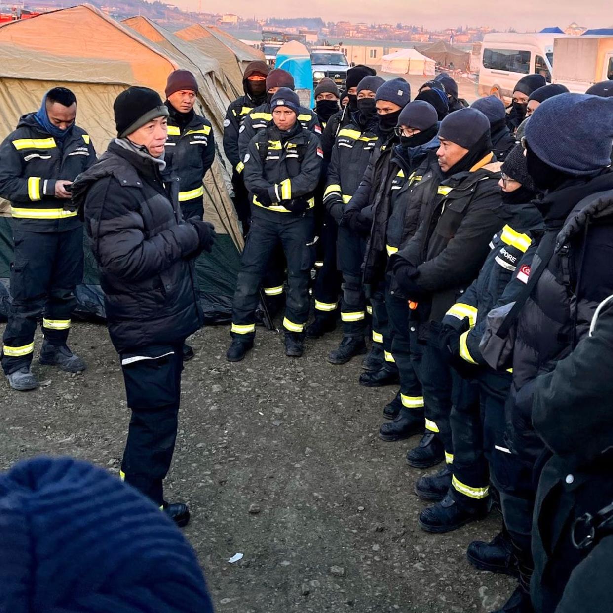 Col Chew Keng Tok, Contingent Commander, briefing the two teams prior to their deployment in the city centre to conduct assessment operations.