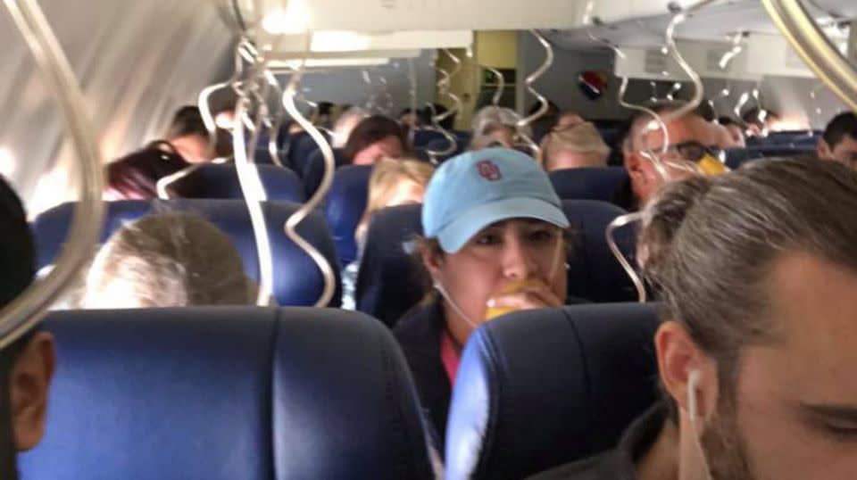 Oxygen masks dropped down as the plane prepared to make an emergency landing. Source: Facebook/Marty Martinez