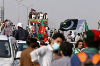 Supporters of Pakistan’s defiant former Prime Minister Imran Khan take part in an anti-government rally in Islamabad, Pakistan, Thursday, May 26, 2022. Khan early Thursday warned Pakistan's government to set new elections in the next six days or he will again march on the capital along with 3 million people. (AP Photo/Anjum Naveed)