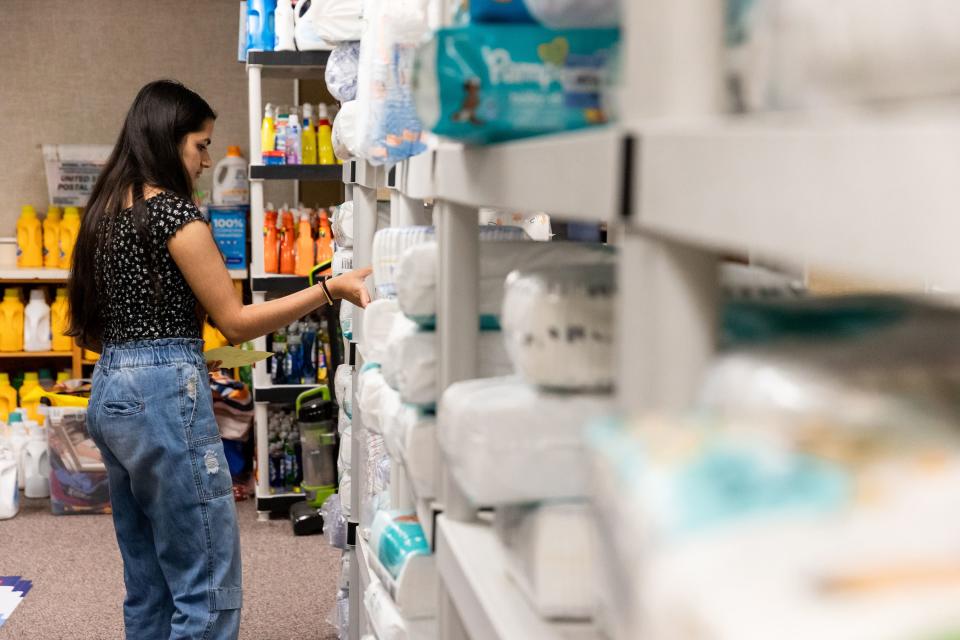 Deevya Baral, an intern at the Serve Refugees Sharehouse, grabs supplies for a customer at the facility in South Salt Lake on Thursday, July 13, 2023. | Megan Nielsen, Deseret News