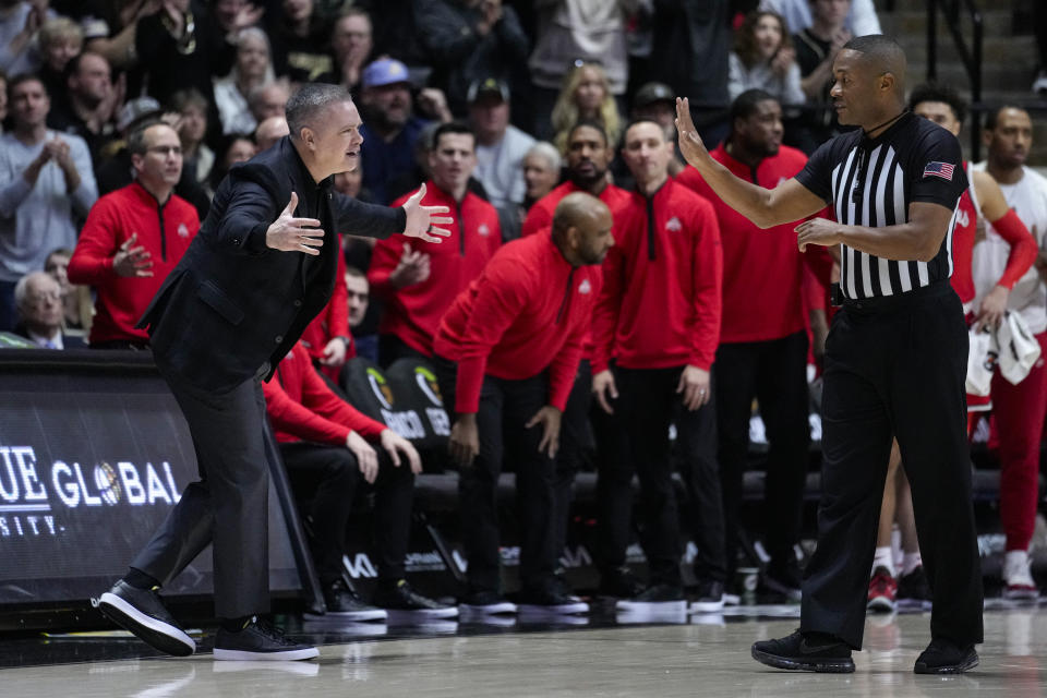 Ohio State head coach Chris Holtmann questions a call as his team played against Purdue in the first half of an NCAA college basketball game in West Lafayette, Ind., Sunday, Feb. 19, 2023. (AP Photo/Michael Conroy)