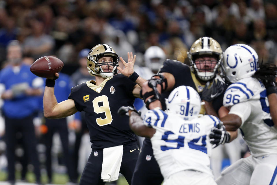 New Orleans Saints quarterback Drew Brees (9) throws a touchdown pass that tied Peyton Manning for the NFL record for most career touchdown passes in the first half of an NFL football game against the Indianapolis Colts in New Orleans, Monday, Dec. 16, 2019. (AP Photo/Butch Dill)